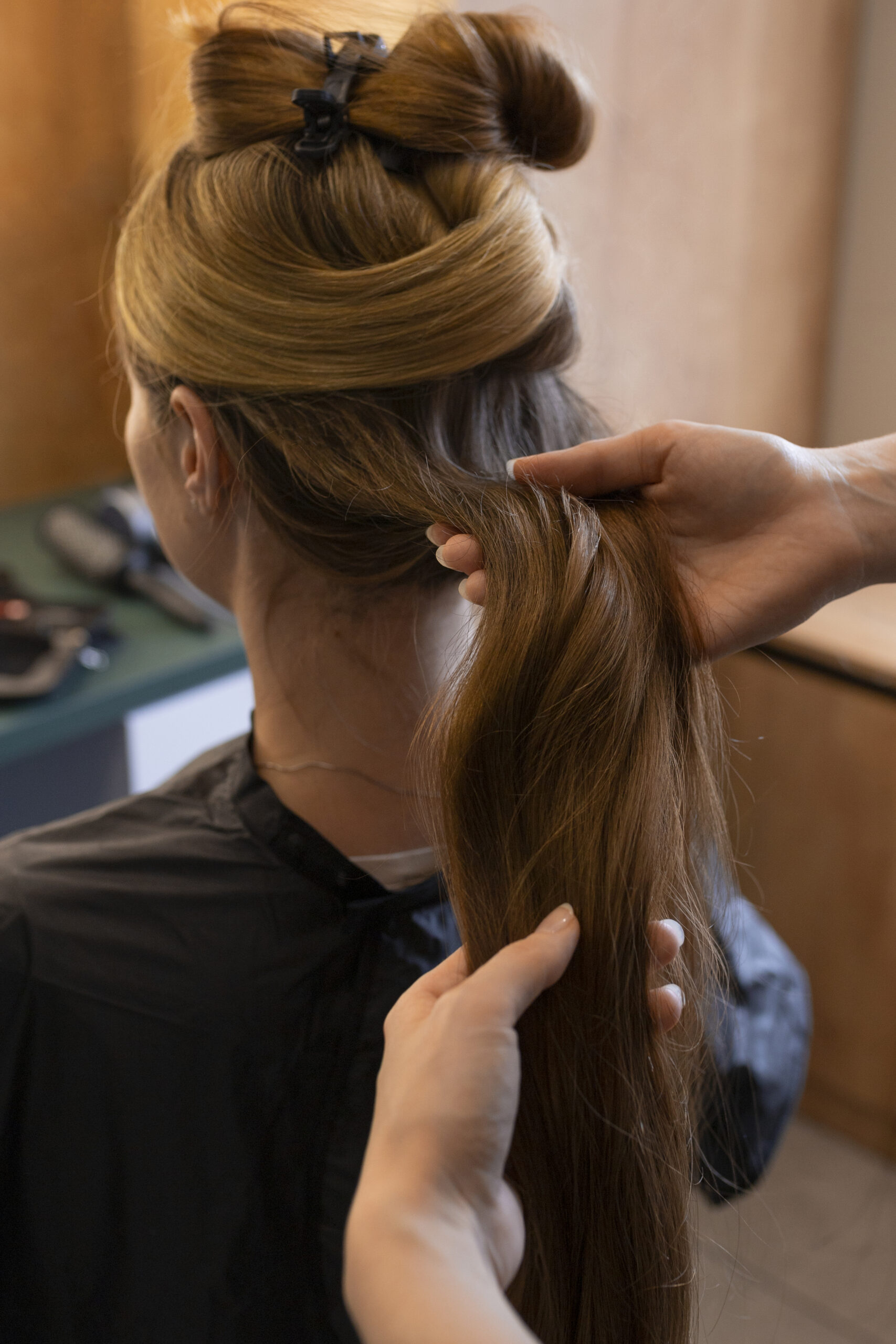 female client getting her hair done hairdresser